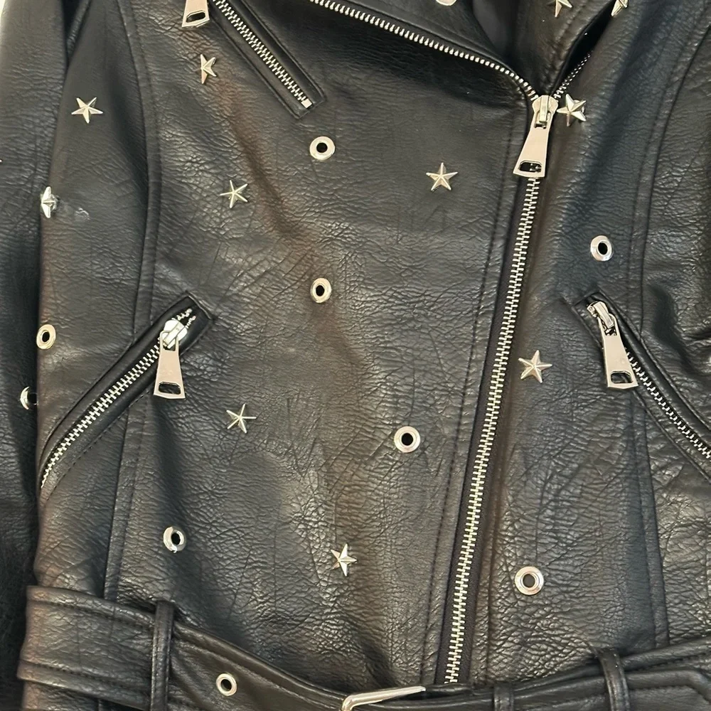 Edgy Moto jacket with studs, perfect layering over jeans or a skirt